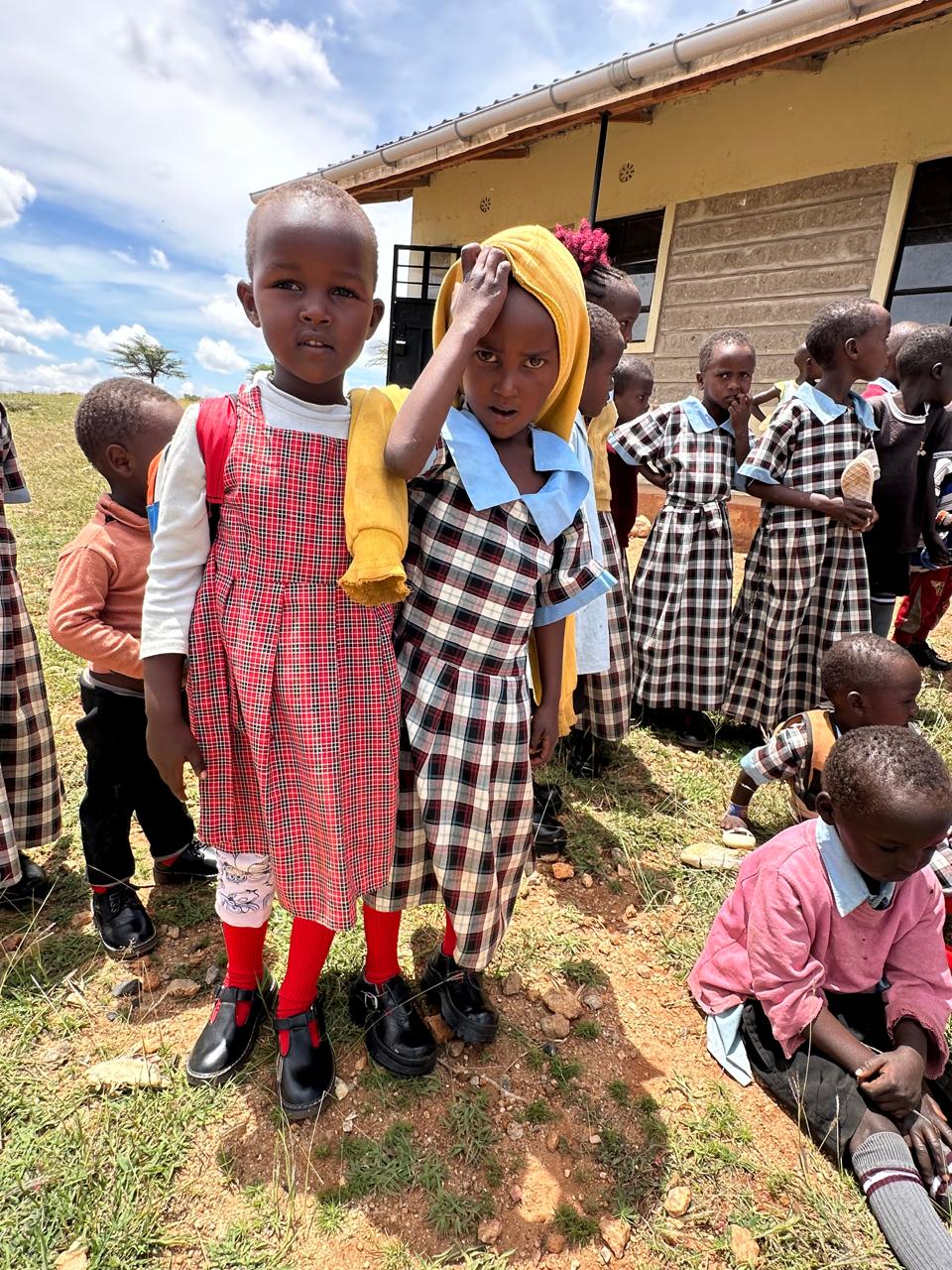 Girls and community members during a program activity