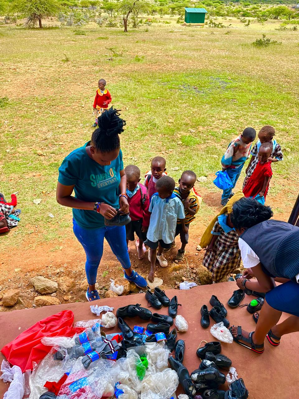 Girls and children taking part in a support activity